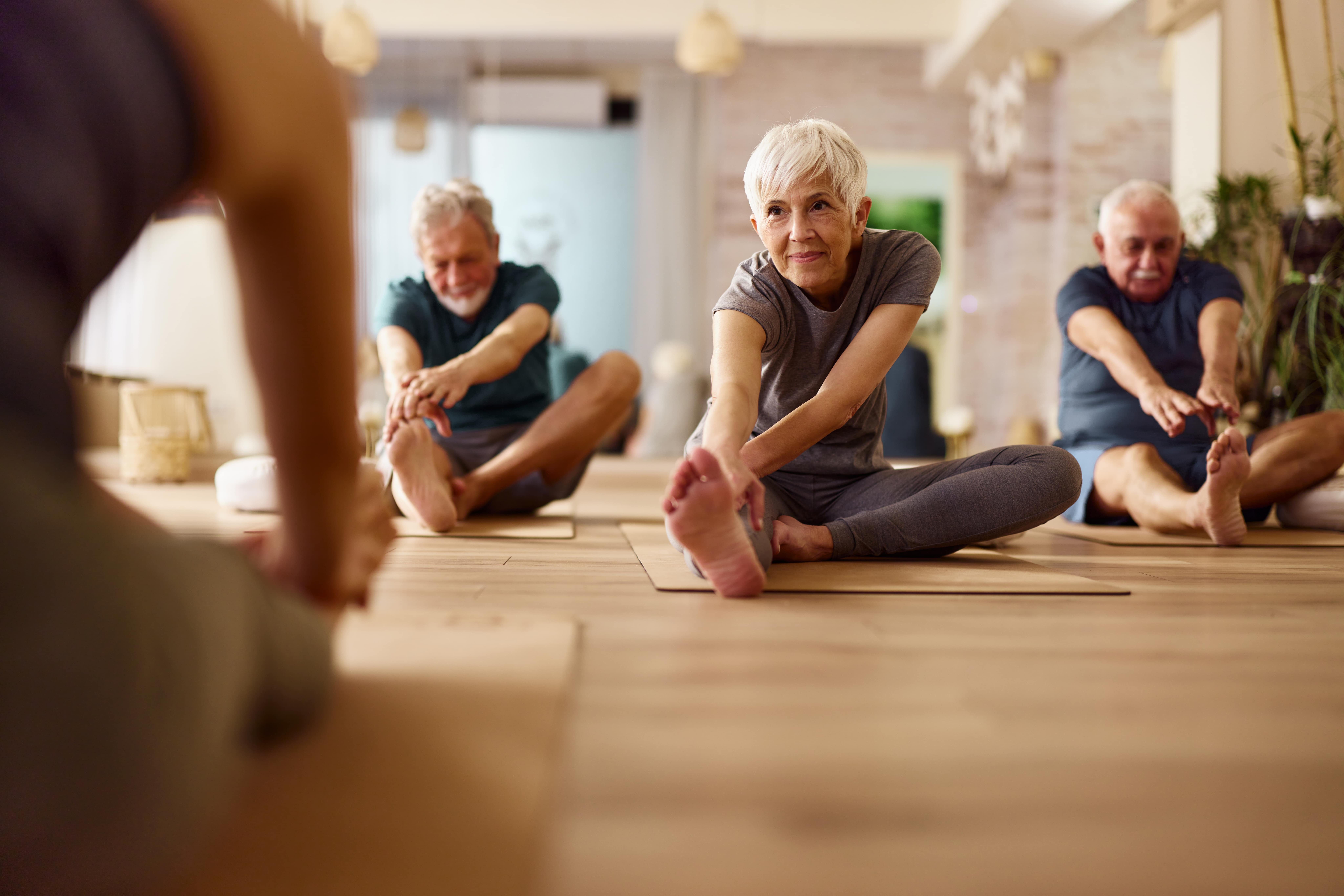 Seniors doing yoga